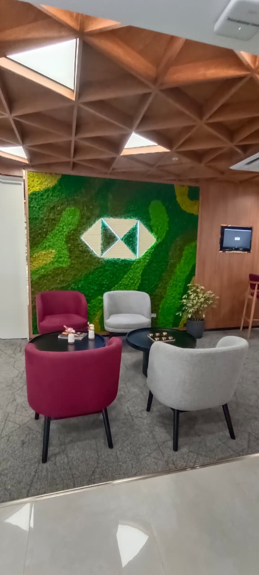 HSBC Nagpur — signature moss wall with illuminated brand logo