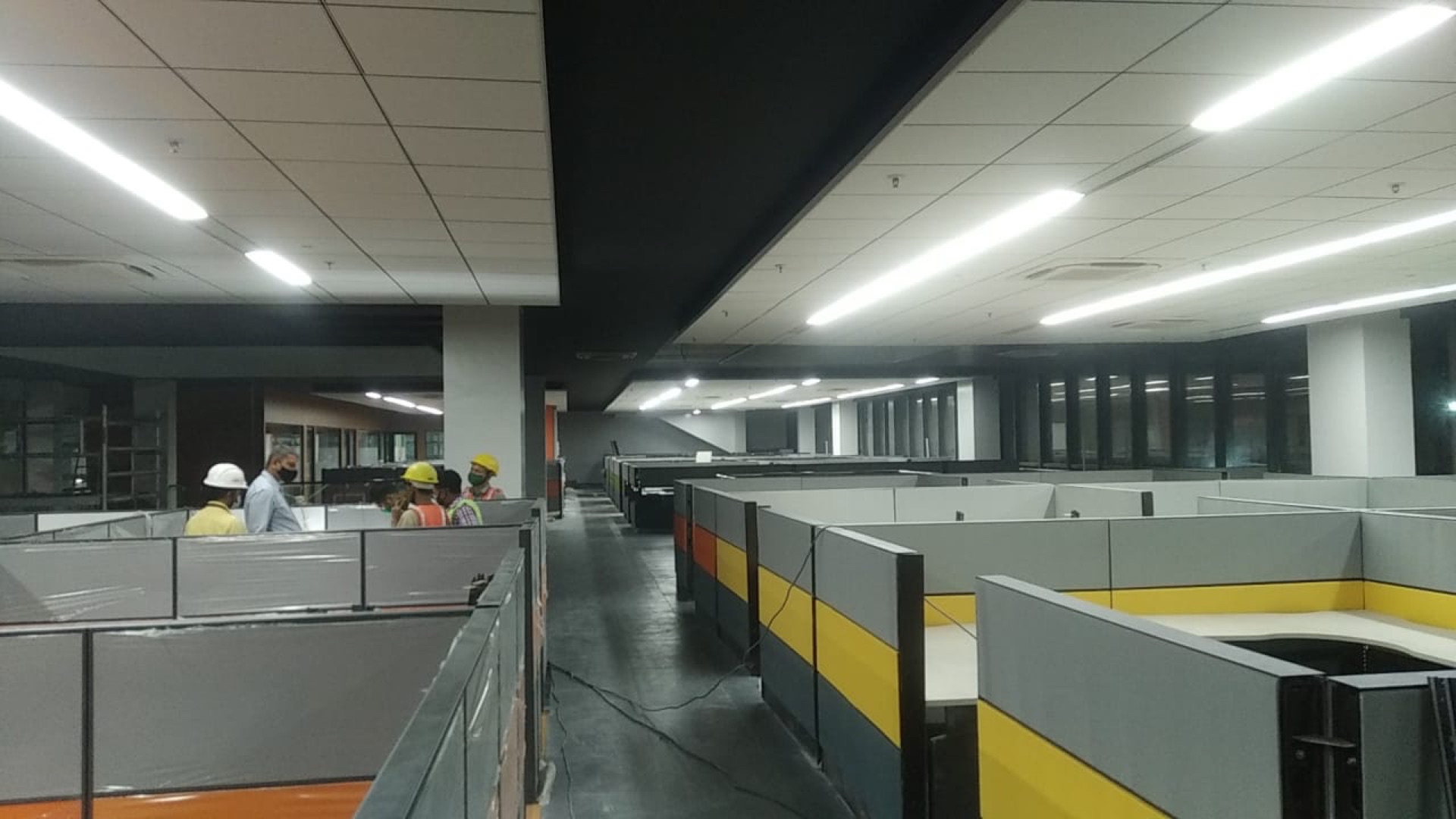 Open-plan floor with yellow accents